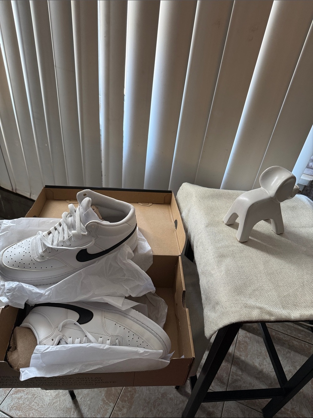 Nike White High-Top Sneakers with Black Swoosh Accent